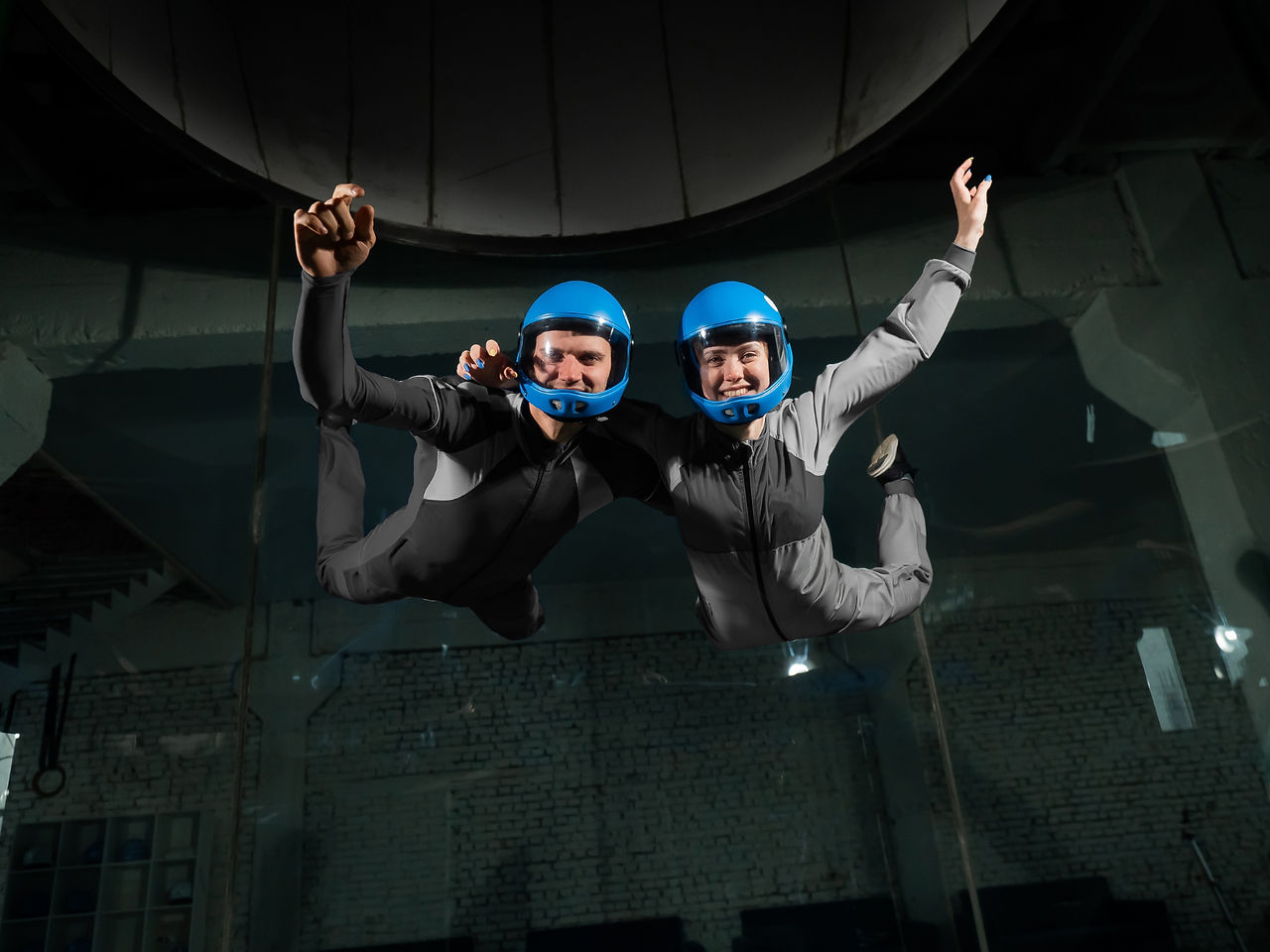 people indoor skydiving